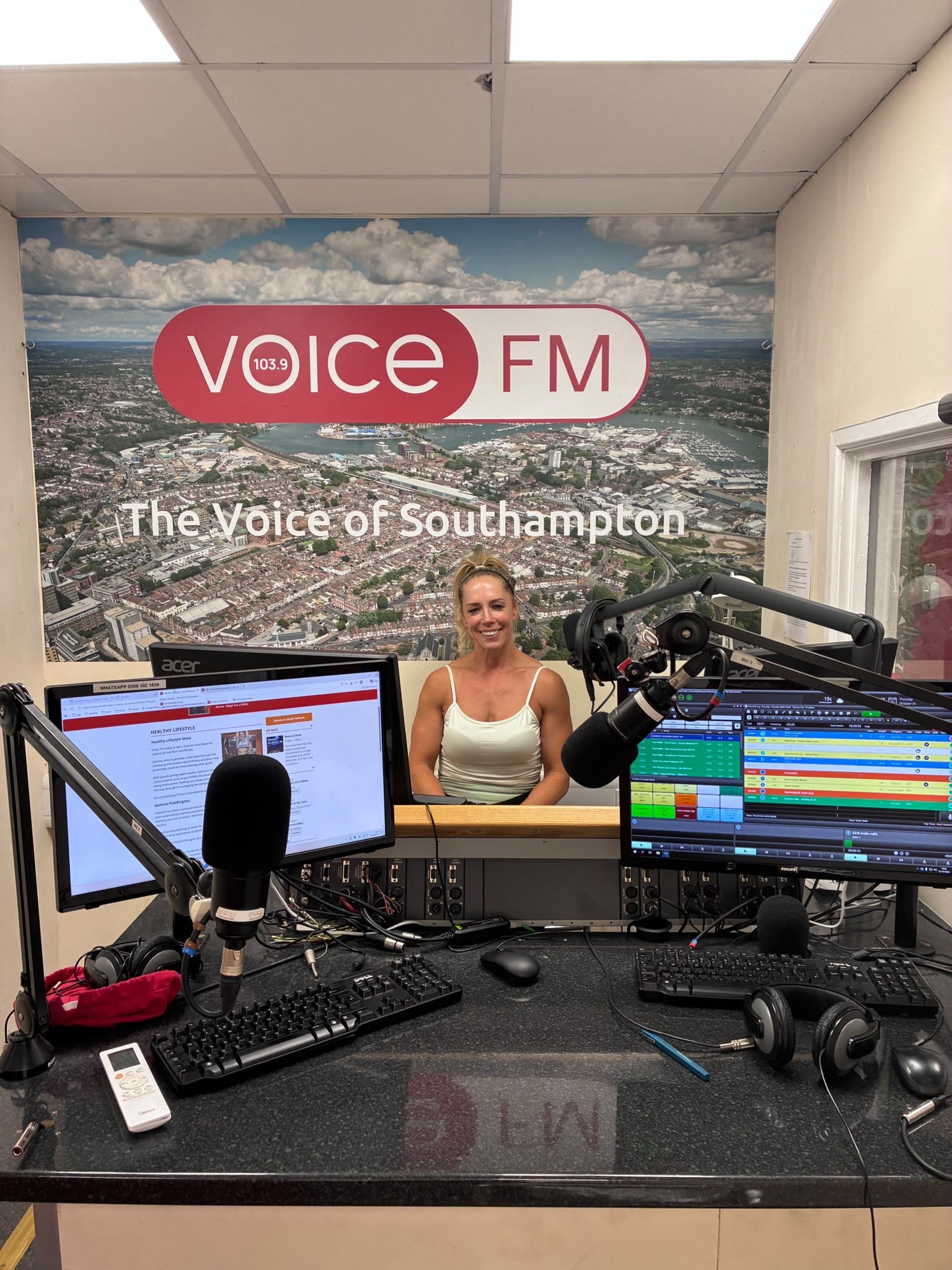 Gemma Paddington seated at the Voice FM studio desk