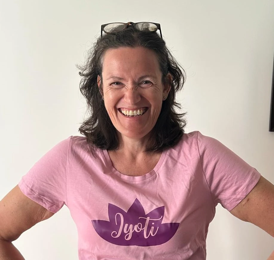 Jyoti Harvey smiling in a Jyoti branded shirt