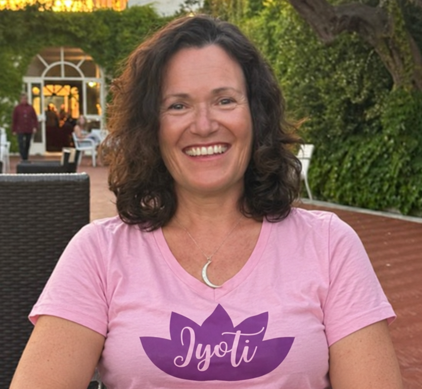 Jyoti Harvey smiling in her pink Jyoti shirt
